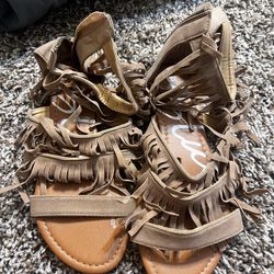 Women’s blue indigo fringe sandals. Size 6