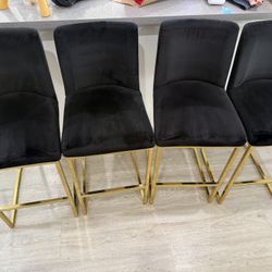modern velvet bar stool (or counter stool) with a gold metal base.4 Pieces 