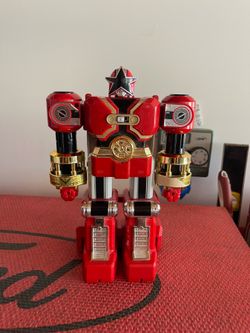 Power Rangers Zeo Red Battlezord action figure, manufactured by Bandai.  Year: Originally released in 1996.  Features: Features motorized punching act