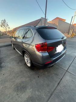 BMW x1  2015  L) & R). Light s  like new
