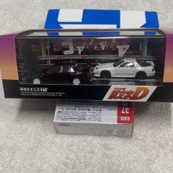 1:64 Modelers Initial D Rx7 White & Mitsubishi Lancer Evil Black