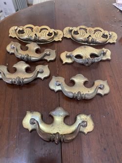 Seven brass dresser handles