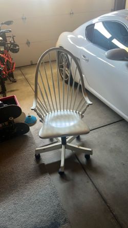Antique white highback swivel chair
