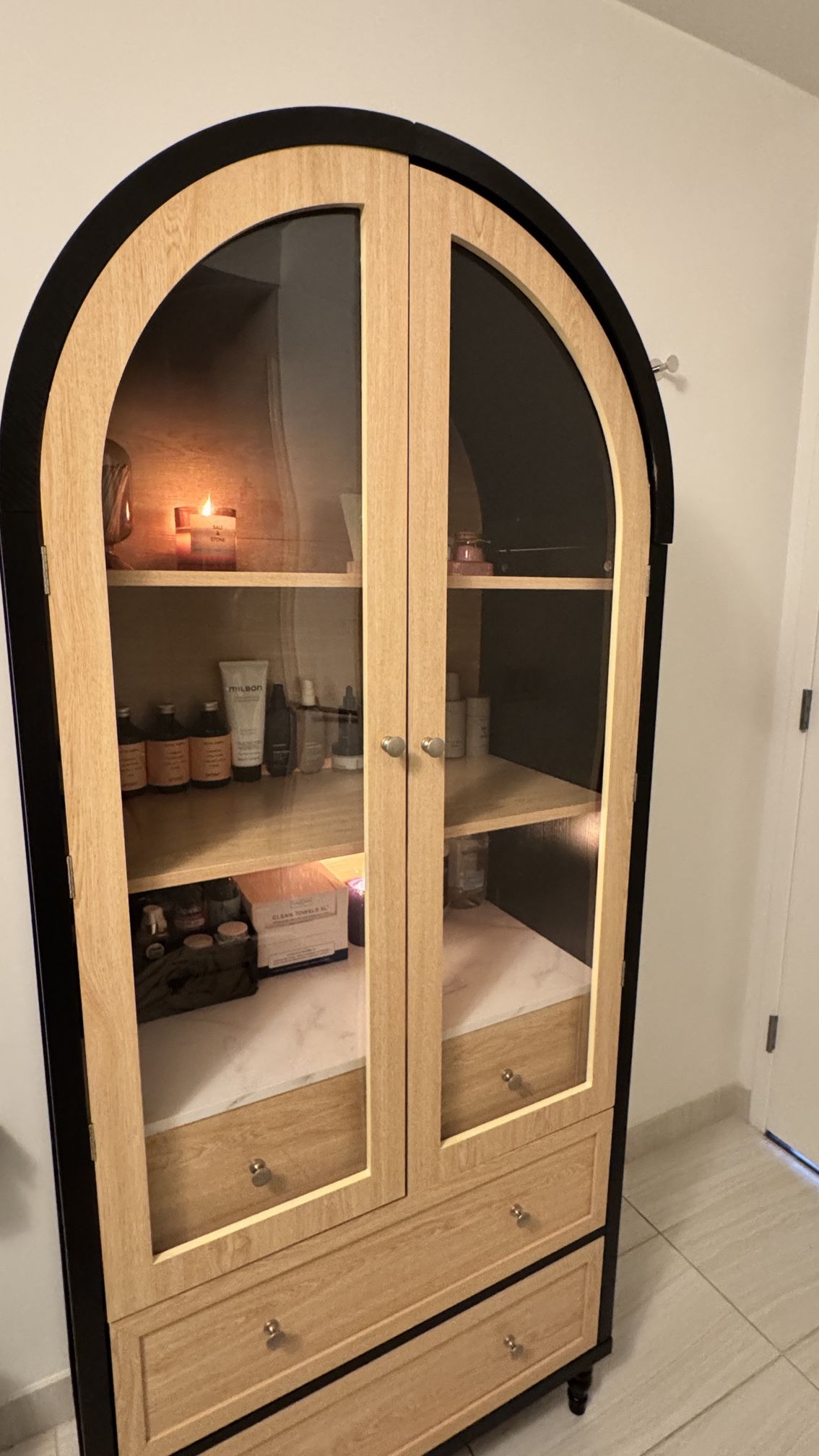 73” Arched Glass Door Cabinet with Drawers – Modern Wood and Black Frame
