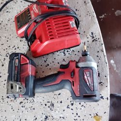 Milwaukee compact drill with charger and battery