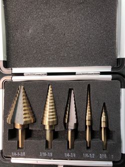 Step drill bits
