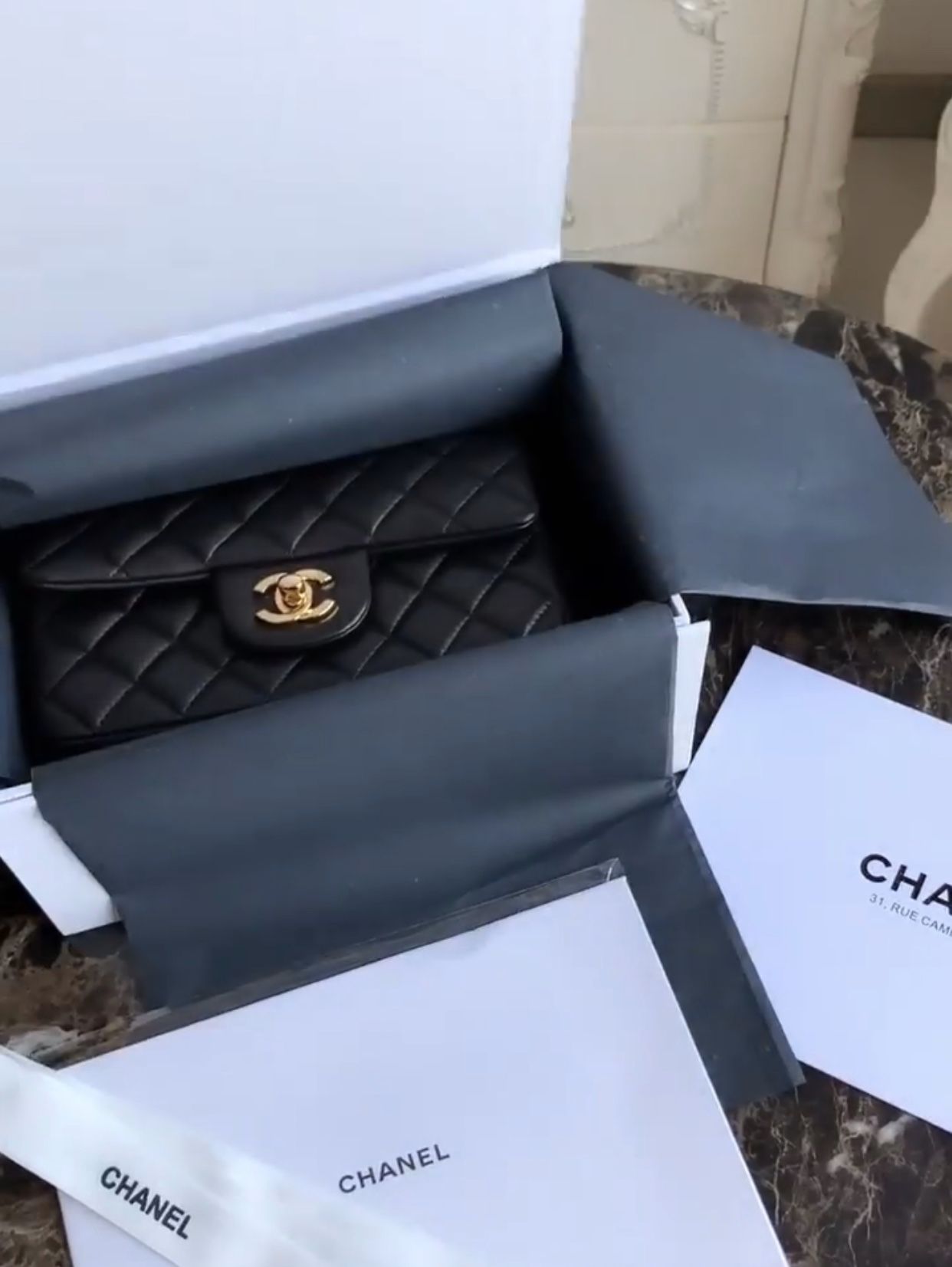 Chanel black crossbody leather bag with golden accents