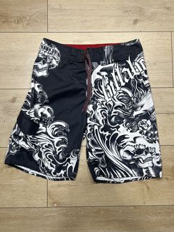 Billabong board shorts feature a graphic print of skulls