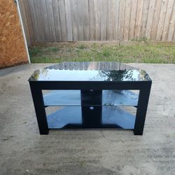 Tv Stand With  Glass Tops And One Taller Mountable.