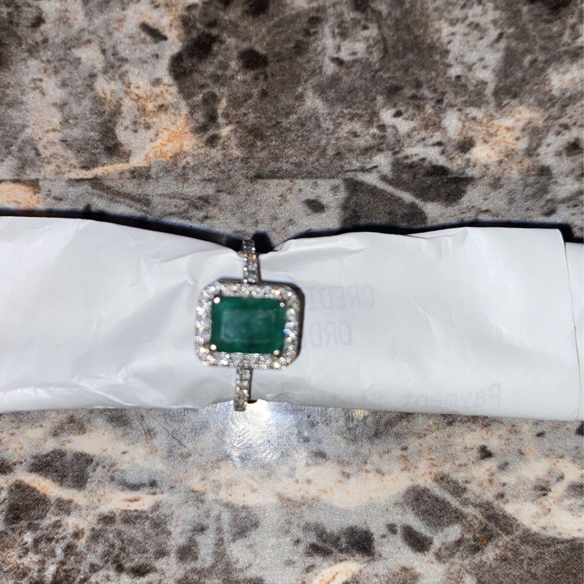 1.0 Carat emerald cut with Natural emerald 3/4 diamonds 14 karat White Gold Setting 
