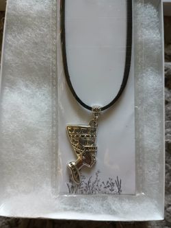 Egyptian Symbol necklace With A Black Leather Cord.