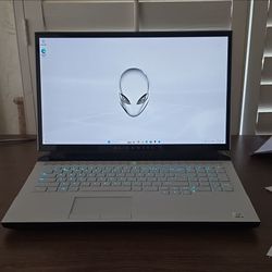 White and black Alienware Area-51m gaming laptop