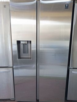 Samsung side by side refrigerator with water and ice dispenser with a 2 MONTH WARRANTY