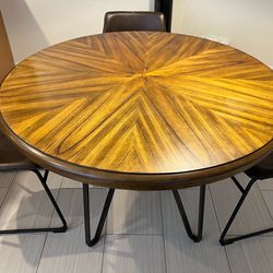 Solid wood round dining table with metal legs