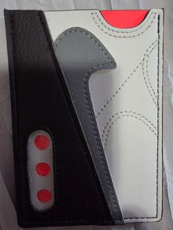 Nike Icon Air Max 90 Card Wallet in the Neutral Grey, Infrared, and Cool Grey colorway, designed to look like the iconic sneaker.