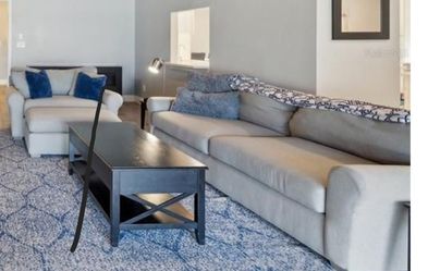 Modern Living Room Set Gray W/Blue/Gray Rug And Black Tables And Silver Lamp