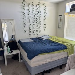 Queen bed and memory foam topper