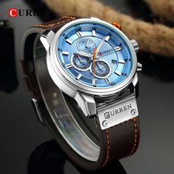 men's chronograph quartz watch with an ice blue dial and a brown leather strap.