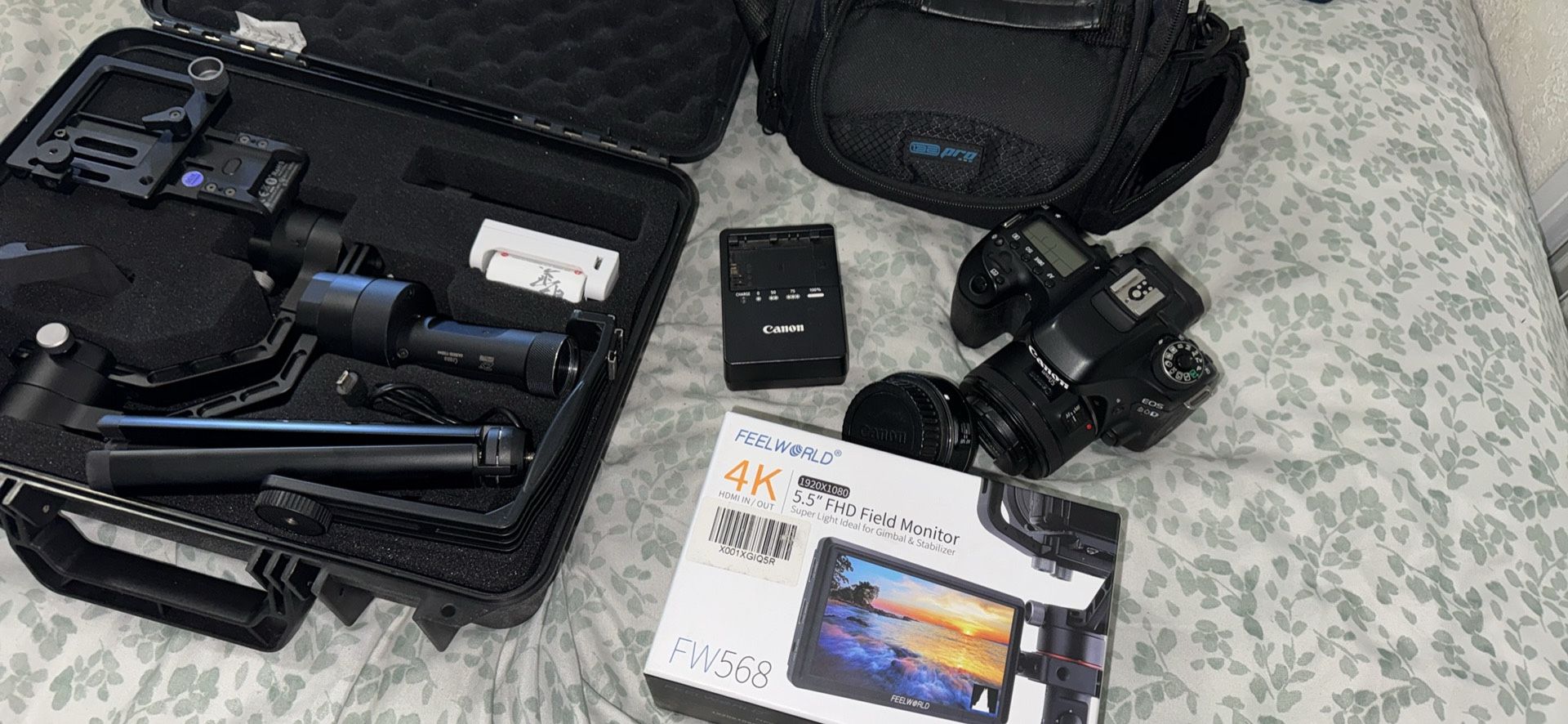 canon 80d ,and 2 lens, 24mm lens and 50mm lens and gimbal and lcd monitor an bags one battery