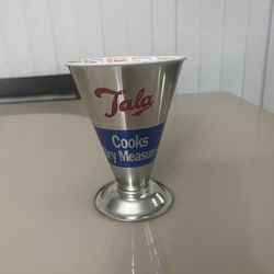 VINTAGE TALA ALUMINUM MEASURING CUP MADE IN ENGLAND. Used in good cosmetic condition with some minor scratches and scuff marks. 