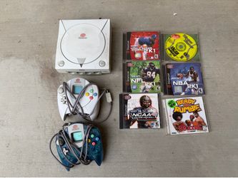 Sega Dreamcast with two controllers six games