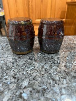 Vintage ceramic Barrel pair of salt and pepper shakers.  Size approximately 3 inches tall.  Preowned no stoppers.