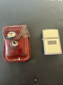 Ivory Zippo lighter with leather case