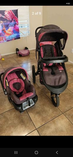 Used Baby trend pink stroller for baby girl base and car seat included