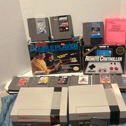 Two NES, two controllers, A duck hunt pew pew, and 1 TV cord, one power cord, nine games, wireless infrared remote controller, double player
