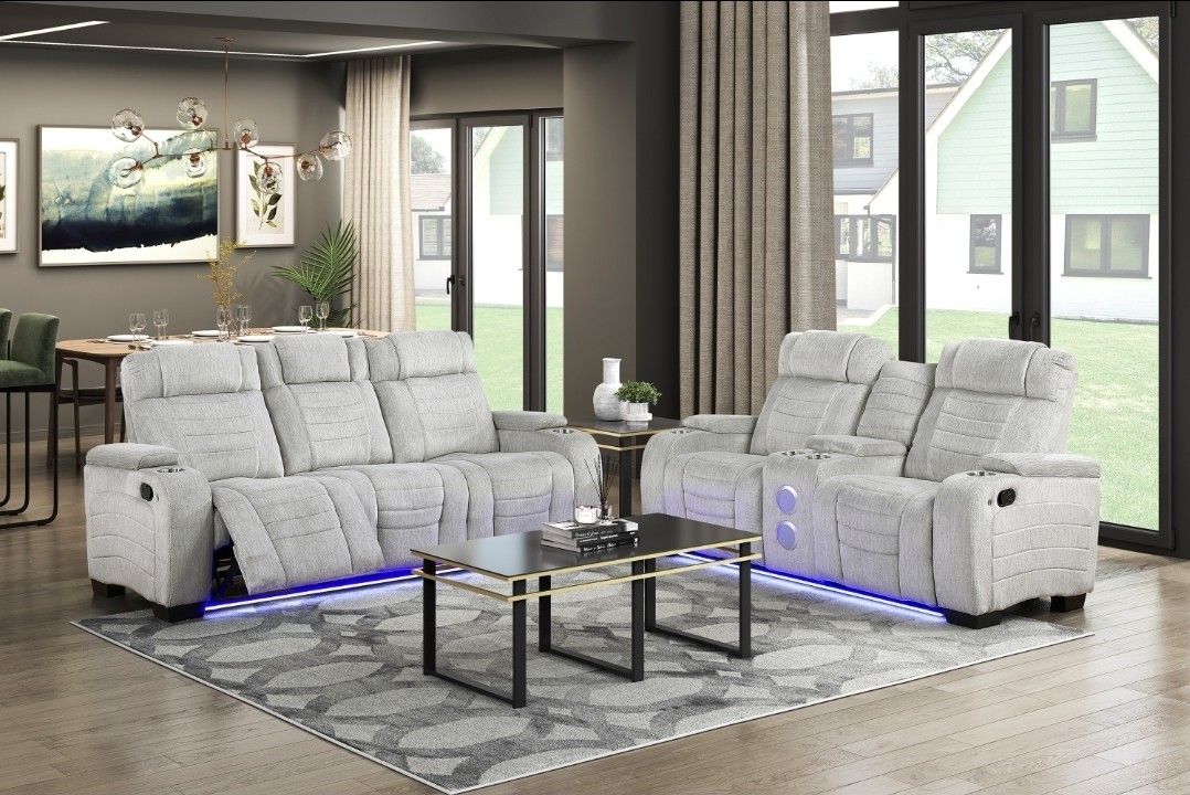 Gray Reclining Sofa And Loveseat With L.E.D And Bluetooth Speakers!! And Reading Light Cupholders Too