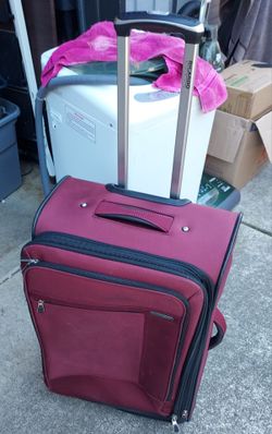 Suitcase with rotating wheels