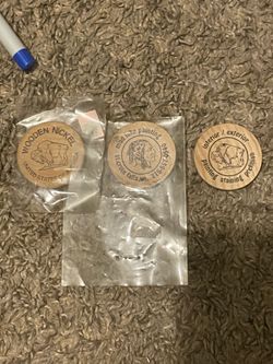 Three vintage wooden nickels