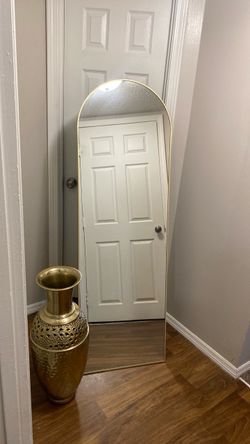Gold stand up mirror and gold vase