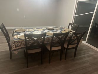 Beautiful dark wood dining room table sitting for 8