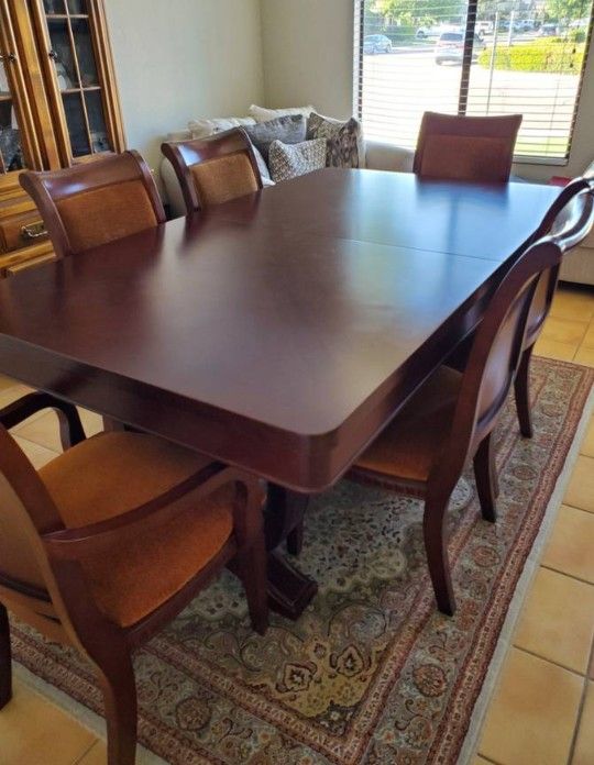 Beautiful dining room table with 6 chairs. Table includes a leaf it extends to fit up to 8 comfortably. 