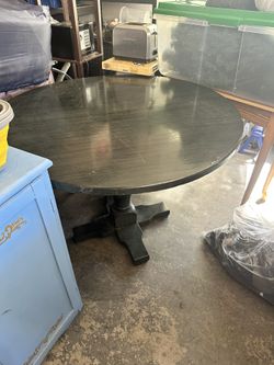 Table And Three Chairs