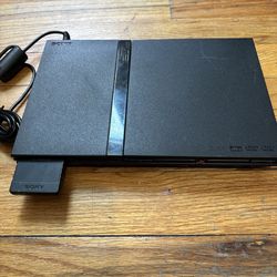 PlayStation 2  includes 2 controllers & four videos games