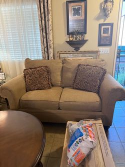 Ashleys Sofa and love seat w/ coffee table included