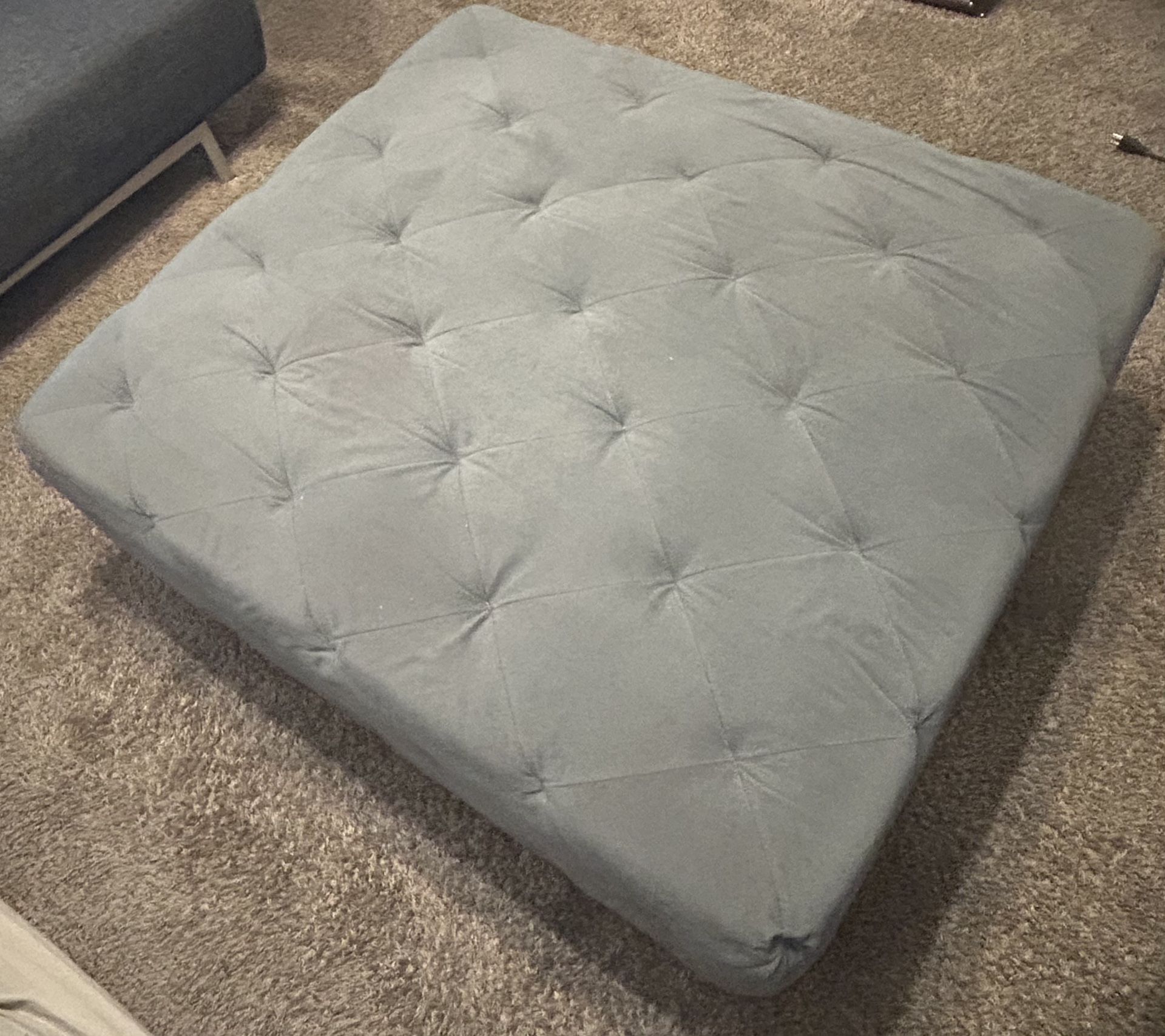 Large gray tufted ottoman