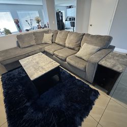 Sectional Couch w/ pullout Bed. Coffee table with 2 side tables