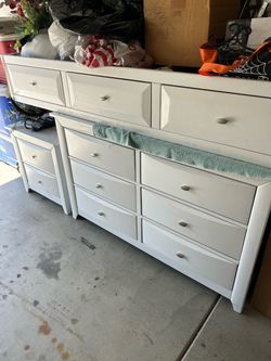 A day bed with dresser and nightstand