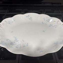 This vintage serving platter is the Johann Haviland Blue Garland pattern, featuring delicate blue floral vines on a white porcelain body with a scallo
