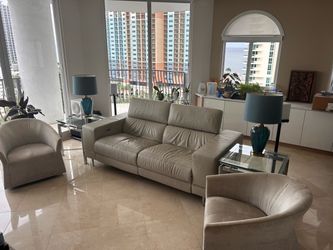 Leather power  reclining sofa , 2 swivel , 2,end table