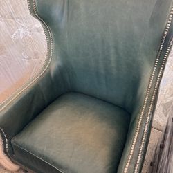 Elegant Green Leather Wingback Chair with Nailhead Trim