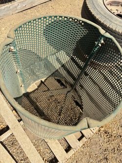Green metal trash can