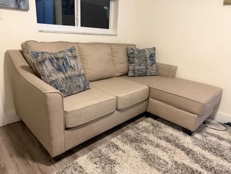 Beige sofa with ottoman