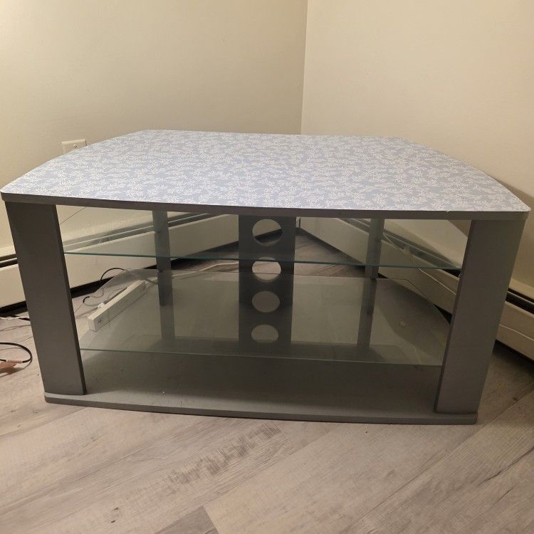 Light blue TV stand with glass shelves
