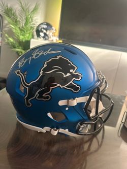 Lions full sized authentic NFL helmet signed by Barry Sanders