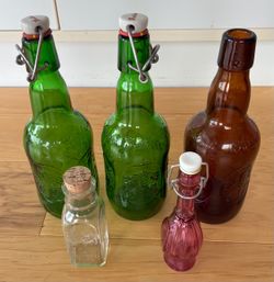 5 decorative glass bottles, all for $20.