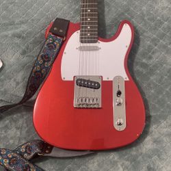 RED AND WHITE STRAT GUITAR WITH BLACK STAR AMP